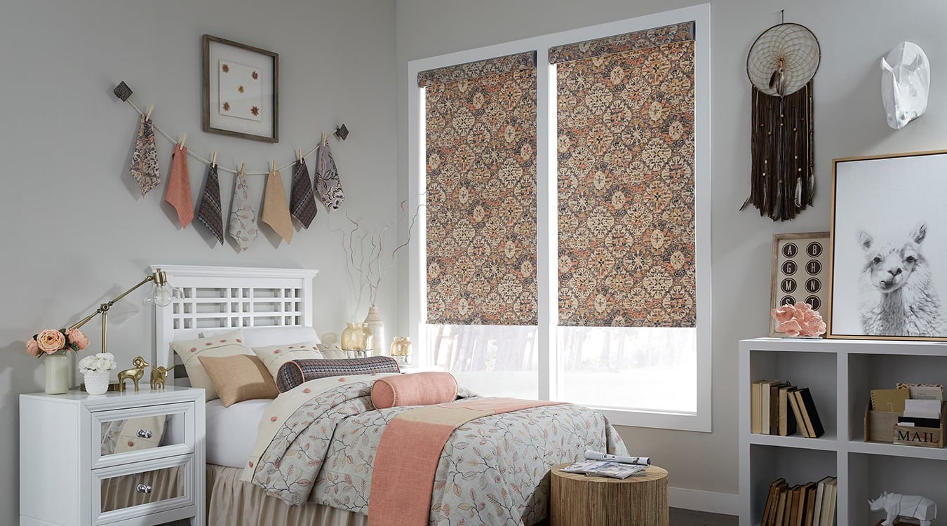 Roller shades in a bedroom.